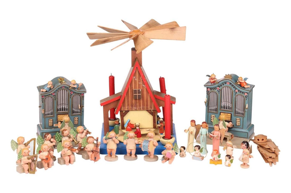 A group of mid-century East German Wendt & Kuhn wooden Christmas table decorations, some with 'WUK': A group of mid-century East German Wendt & Kuhn wooden Christmas table decorations, some with 'WUK' original paper label attached, comprising a pair of clockwork musical organs and assorted musicians,