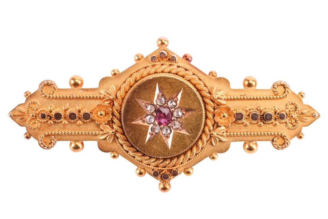 A Victorian mourning brooch in 15ct yellow gold, of Etruscan Revival design, star motif centred in t (1 of 4)