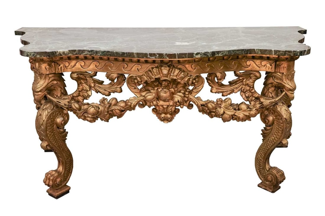 In the manner of William Kent, a serpentine marble-topped carved wood and gilt gesso console table,: In the manner of William Kent, a serpentine marble-topped carved wood and gilt gesso console table, probably 19th century and later, with shaped thick green variegated marble top the base pierced and