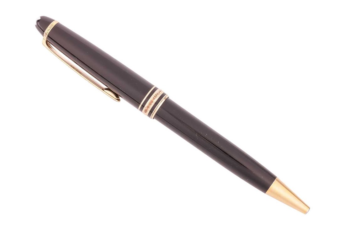 Montblanc - a Meisterstück Classique Ballpoint pen, with twist mechanism, cap and barrel in bla: Montblanc - a Meisterstück Classique Ballpoint pen, with twist mechanism, cap and barrel in black resin, gold-tone hardware, and emblem inlaid in cap top. Serial number: PR1646300 the twist mecha