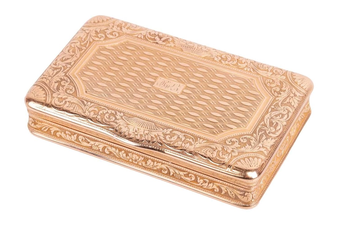 An early 19th century French snuff box, circa 1820, of rectangular form, cover and base chased with (1 of 8)
