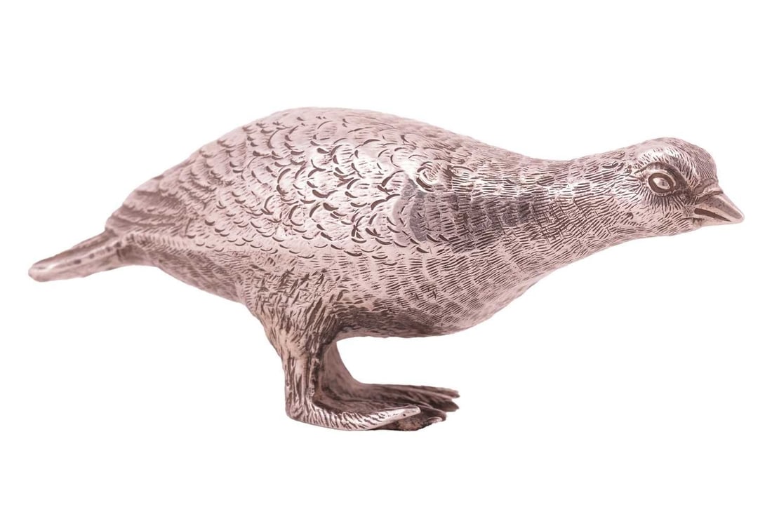 A small modern silver model of hen pheasant,realistically modelled with head lowered. London 1970 by: A small modern silver model of hen pheasant,realistically modelled with head lowered. London 1970 by Richard Comyns. 8cm length. 1.6 ozt.