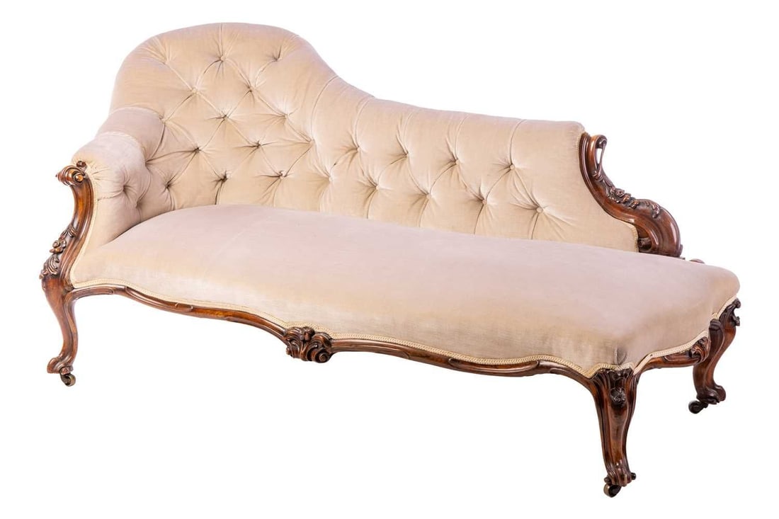 A Victorian serpent-backed rosewood chaise longue, with button back and carved and moulded show: A Victorian serpent-backed rosewood chaise longue, with button back and carved and moulded show frame, on short cabriole supports. 190 cm long x 90 cm deep x 84 cm overall height.