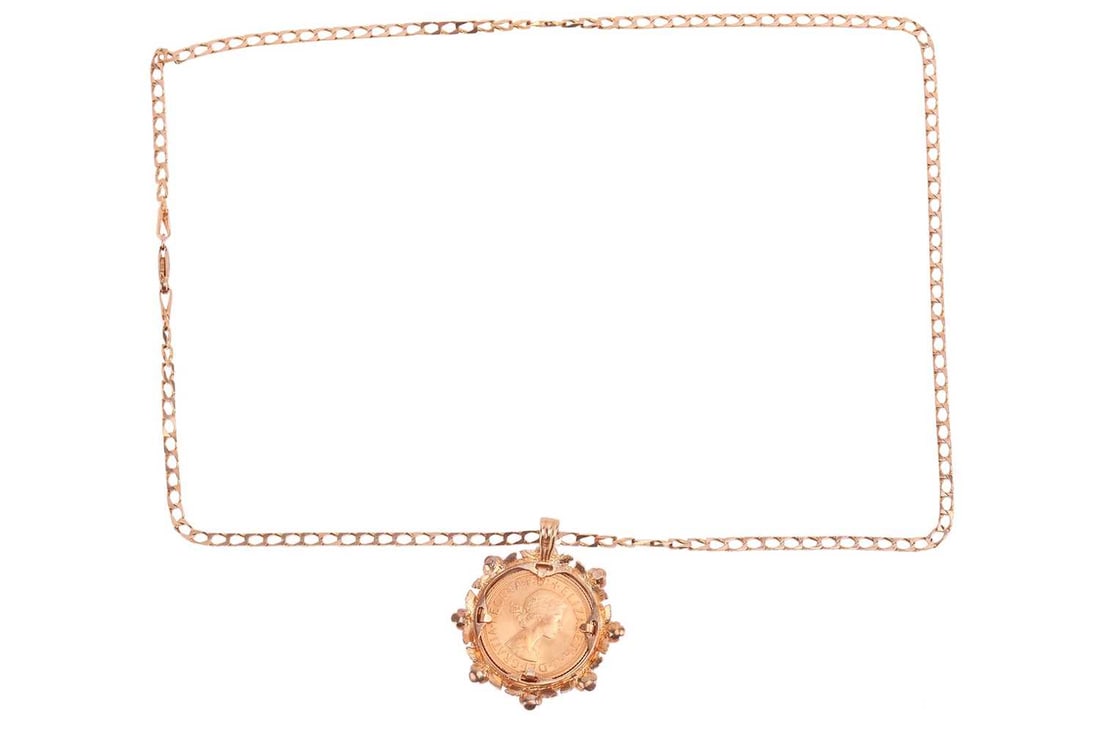 A sovereign pendant and chain, comprising an Elizabeth II full sovereign, 1964, unsoldered in pendan: A sovereign pendant and chain, comprising an Elizabeth II full sovereign, 1964, unsoldered in pendant mount, with foliate and floral detailing, to a 9ct gold flat square curb chain, measuring approxim