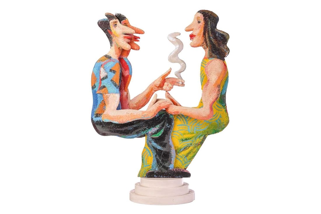 David Gerstein (b.1944) Israeli, Two figures smoking, three-dimensional acrylic on wood, on a: David Gerstein (b.1944) Israeli, Two figures smoking, three-dimensional acrylic on wood, on a stepped circular base, signed to the underside and dated 1989, 65 cm x 48 cm, together with an associated