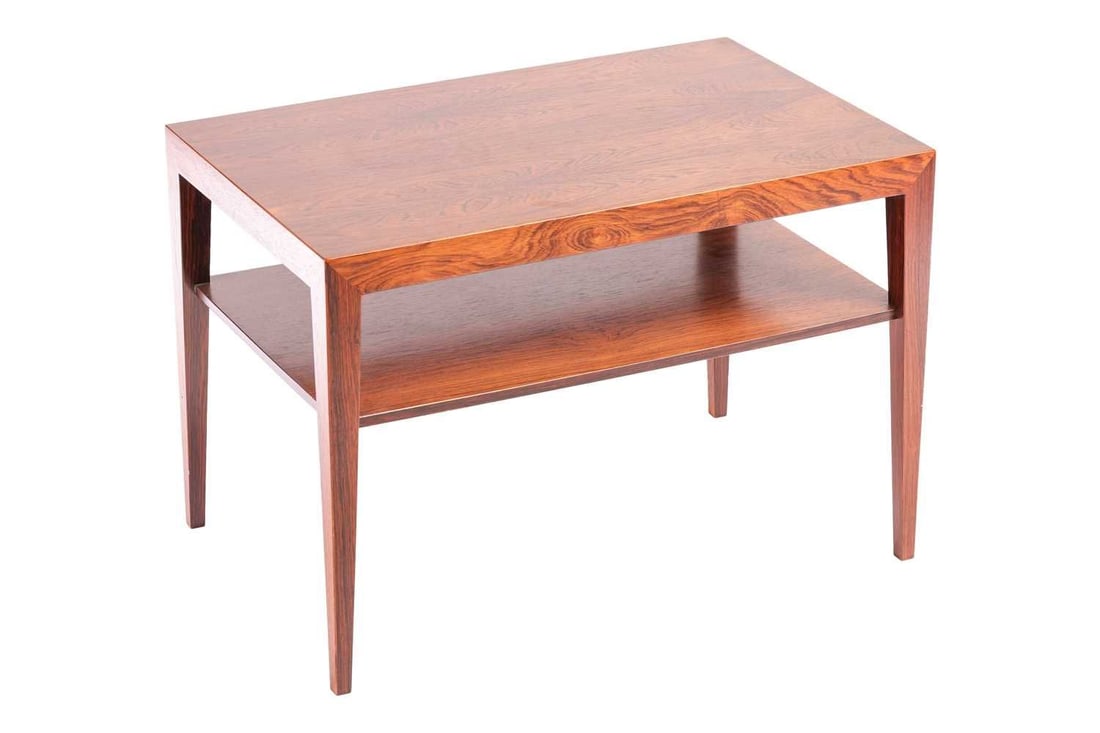 A 1970s Severin Hansen rosewood coffee table, the rectangular top on square section tapering legs: A 1970s Severin Hansen rosewood coffee table, the rectangular top on square section tapering legs joined by an undershelf, 70 cm wide, 44.5 cm deep, 48.5 cm high. CITES Article 10 certificate no. 24GB