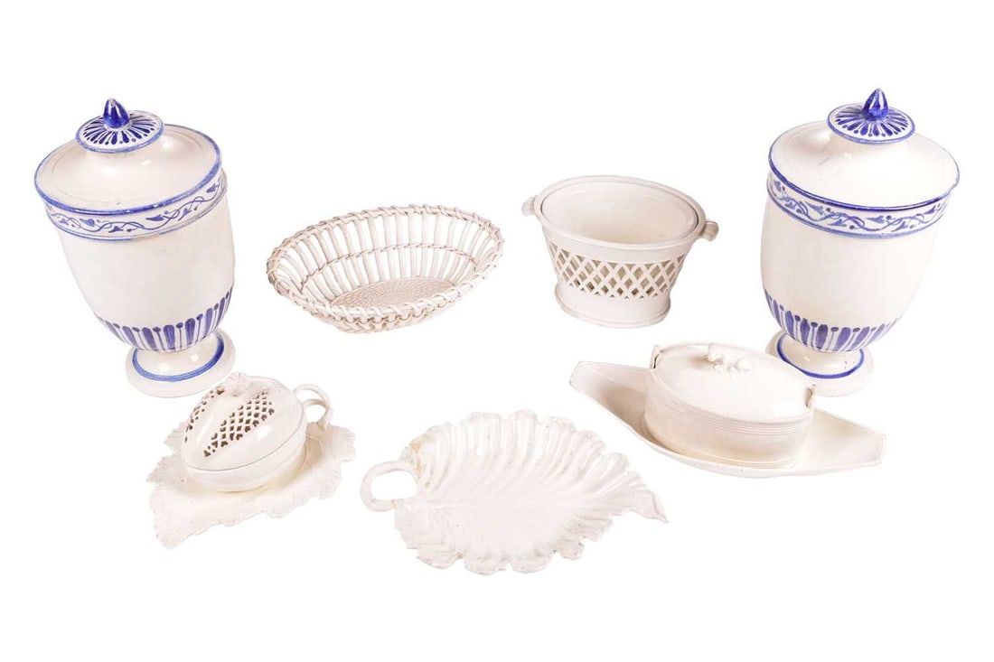 A small collection of creamware porcelain; comprising a melon tureen and cover on a leaf dish, 20 cm: A small collection of creamware porcelain; comprising a melon tureen and cover on a leaf dish, 20 cm wide, a Wedgwood basket, a leaf dish, an ice pail and liner and others, together with later pair of