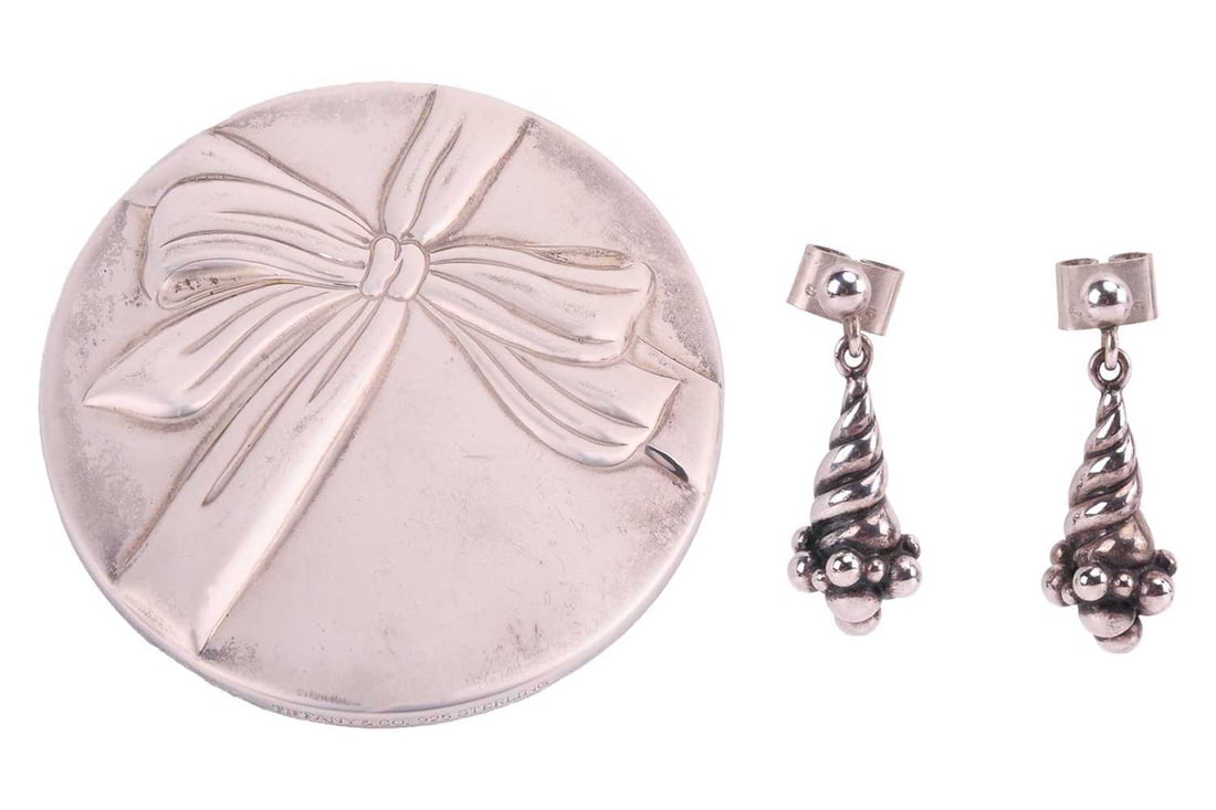 A pair of Georg Jensen earrings and a Tiffany & Co compact mirror; A pair of Georg Jensen white: A pair of Georg Jensen earrings and a Tiffany & Co compact mirror; A pair of Georg Jensen white metal drop earrings, designed by Ole Kortzau, number 363 of drop grape design, length approximately