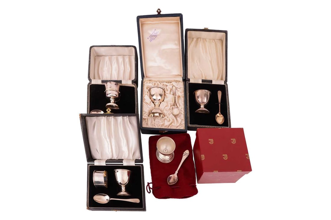 Two silver Christening egg cups and spoons in fitted cases, one with an associated hallmarked spoon,: Two silver Christening egg cups and spoons in fitted cases, one with an associated hallmarked spoon, another white metal egg cup, marked 900 and spoon marked 850 another silver egg cup and spoon with