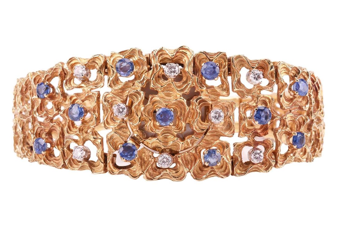 Bucherer - a modernist cocktail watch set with diamond and sapphire, comprising a series of tapered: Bucherer - a modernist cocktail watch set with diamond and sapphire, comprising a series of tapered abstract hinged links, set with eight brilliant-cut diamonds and eleven circular-cut sapphires, with