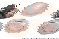 A Harlequin three-piece tea service and tray, of octagonal form chased with cherubs within scrolled