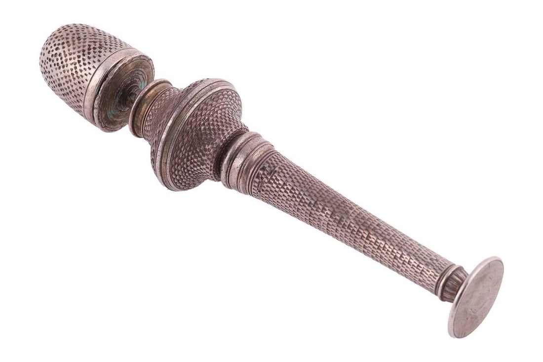 A mid 18th Century needle case with detachable thimble, engineturned, white metal unmarked,: A mid 18th Century needle case with detachable thimble, engineturned, white metal unmarked, measuring 9.6 cm in length, weight 36.4 grams (1.17 ozt).