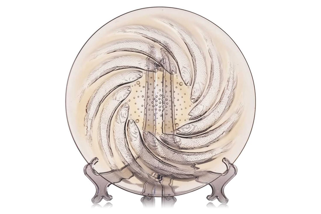 Rene Lalique (1860-1945), a Poissons pattern shallow dish, Number 3263, designed 1921, with a: Rene Lalique (1860-1945), a Poissons pattern shallow dish, Number 3263, designed 1921, with a repeating swirl pattern in opalescent glass, 29.8 cm diameter, impressed 'R Lalique' mark to the centre.