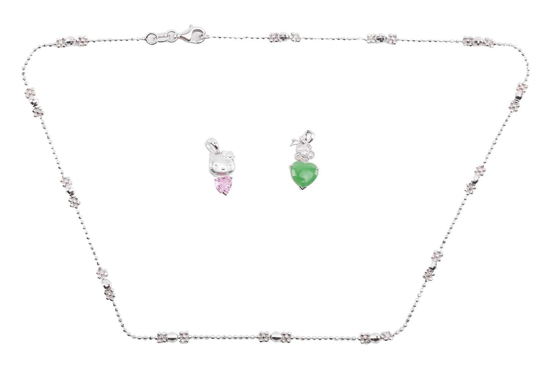 Two Chow Sang Sang heart-shaped pendants and a fancy link chain; first to include a heart-cut pink s: Two Chow Sang Sang heart-shaped pendants and a fancy link chain; first to include a heart-cut pink sapphire claw-set to a sandblasted Hello Kitty surmount, white metal stamped '18K' with maker's mark,