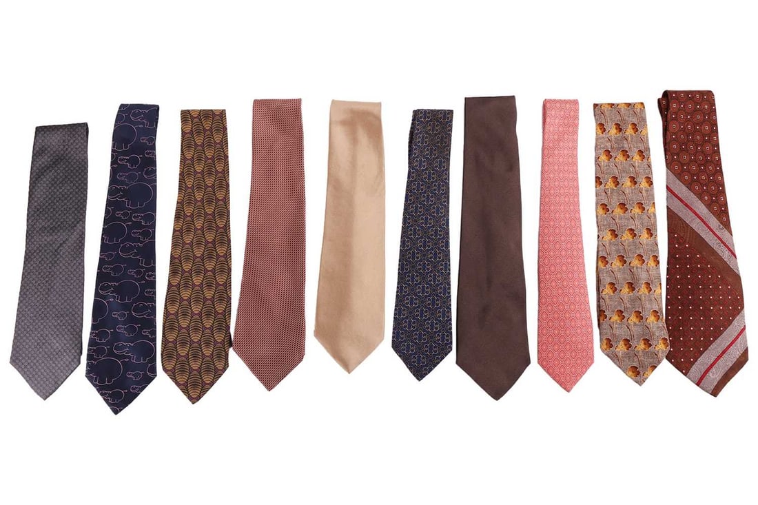 A collection of ten silk ties, including two examples by Hermes, two by Donna Karan, one by Yves Sai: A collection of ten silk ties, including two examples by Hermes, two by Donna Karan, one by Yves Saint Laurent, one by Giorgio Armani, one by DKNY, one by Bill Blass, one by Ermenegildo Zegna and one