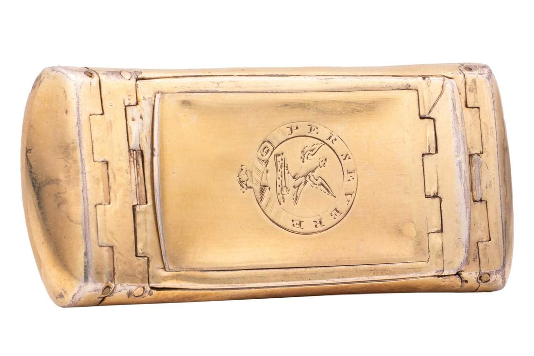 A George III silver gilt double snuff box, by John Thornton, Birmingham 1810, of curved rounded: A George III silver gilt double snuff box, by John Thornton, Birmingham 1810, of curved rounded rectangular form, the double hinged cover open to reveal twin apertures, cover engraved with clan crest