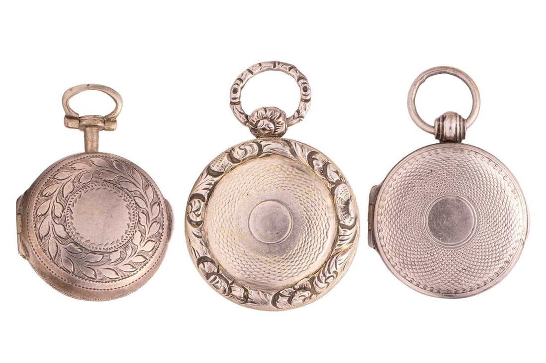 Three early 19th-century silver vinaigrettes of round form, with suspension bows allowing them to be: Three early 19th-century silver vinaigrettes of round form, with suspension bows allowing them to be worn on chains or chatelaines; to include a George III example by William Lea & Co., Birmingham 181