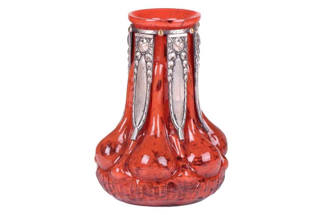 Paul Daum and Pierre D’Avesn for ‘Verreries D’Art Lorrain’, an unusual blown red glass vase: Paul Daum and Pierre D’Avesn for ‘Verreries D’Art Lorrain’, an unusual blown red glass vase of lobed form, circa 1930, with silvered bronze mounted neck cast with flowers and drapes, signed 'V