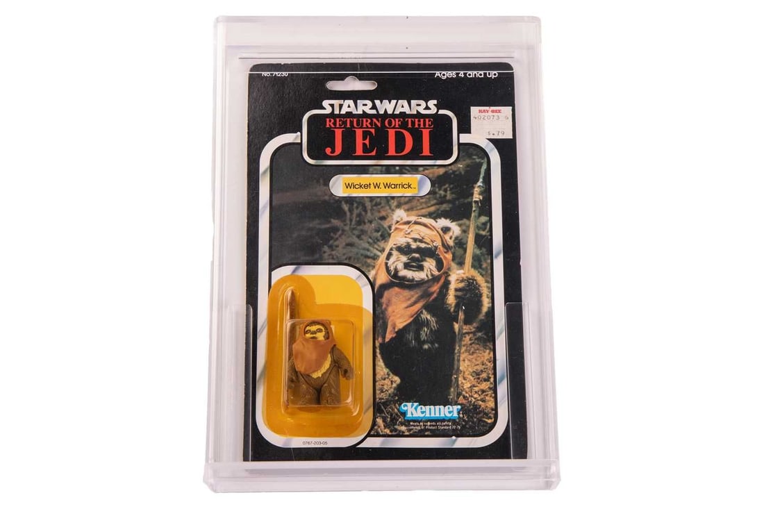 Star Wars: a vintage Kenner Wicket W. Warrick carded figure, Return of the Jedi, No. 71230, punched: Star Wars: a vintage Kenner Wicket W. Warrick carded figure, Return of the Jedi, No. 71230, punched 77 clear bubble packaging, housed in a bespoke acrylic display case. Original shop price sticker aff