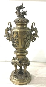 Japanese bronze incense burning censer. Features lidded top with a figural dragon finial, opposing s