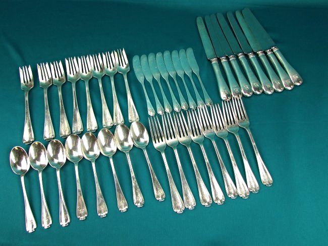 TIFFANY & CO Sterling Silver .925 Flatware Set Flemish: 20th Century New York Tiffany & Co. "Flemish" Pattern Sterling Silver Flatware Service.925 8 table knives, 8 forks, 8 salad forks, 8 butter knives, 8 tea spoons. Weight approx. 48.5 troy oz.