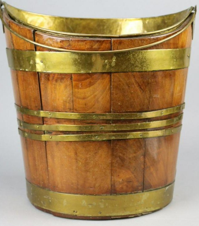 Georgian Mahogany Brass Bound Open Wine Cooler w/: Oval Mahogany Wine Cooler measures 13.5" in height x 13.5" in width x 10" deep. Removable conforming brass liner. Old repair to liner. Age appropriate condition.