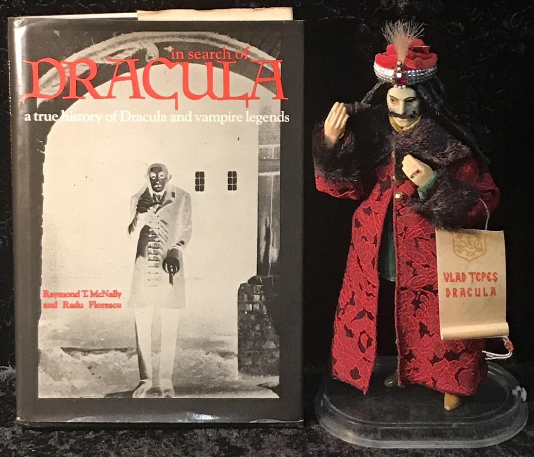 A Vlad Dracula Doll & Book: A Vlad Dracula doll, together with a Dracula book. Good condition with damage to doll's fingers. For dimensions, see photographs.