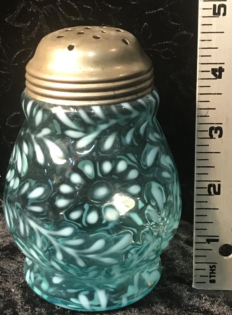 Daisy & Fern Blue Opalescent Sugar Shaker: A Northwood blue opalescent wide waisted glass sugar shaker in the "Daisy & Fern" pattern, late 19th century. Good condition with small dents to the lid. For dimensions, see photographs.