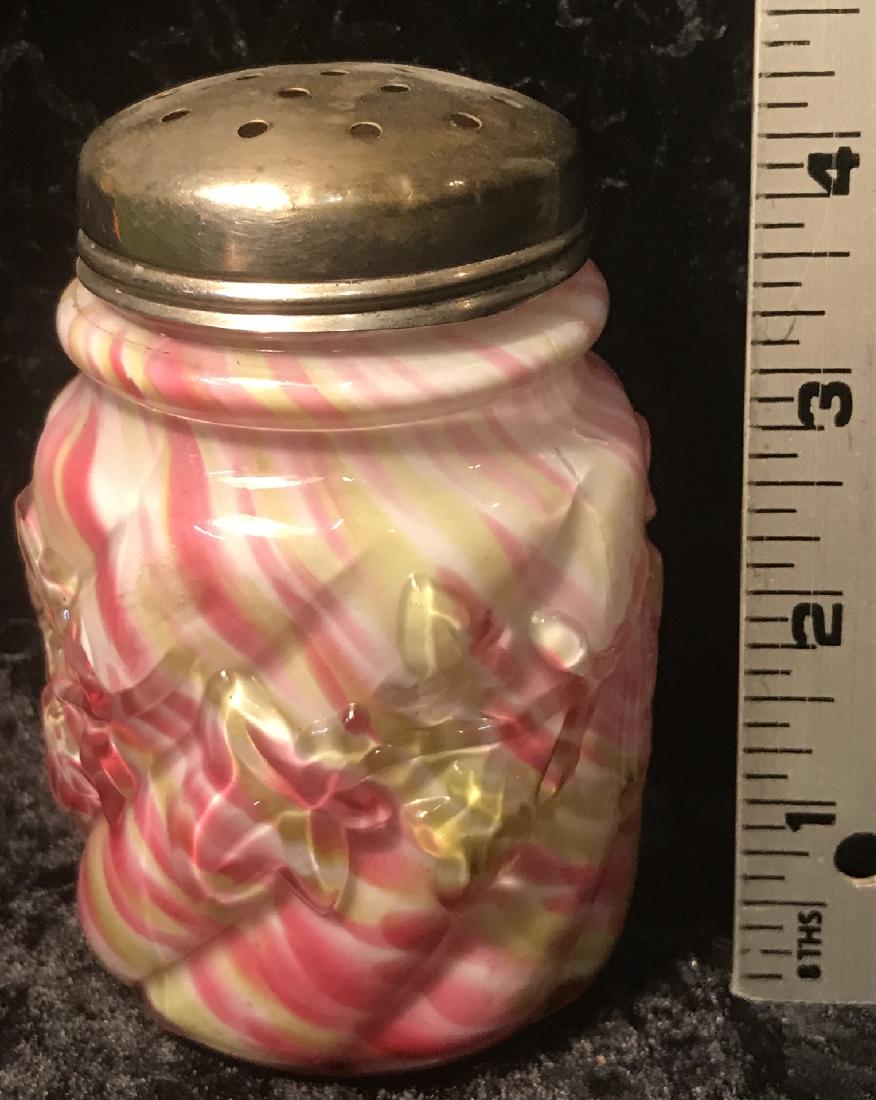 Nortwood Rainbow Spatter Royal Ivy Sugar Shaker: A Northwood cranberry/vaseline spatter cased glass sugar shaker in the "Royal Ivy" pattern, late 19th century. Good condition with lid wear. For dimensions, see photographs