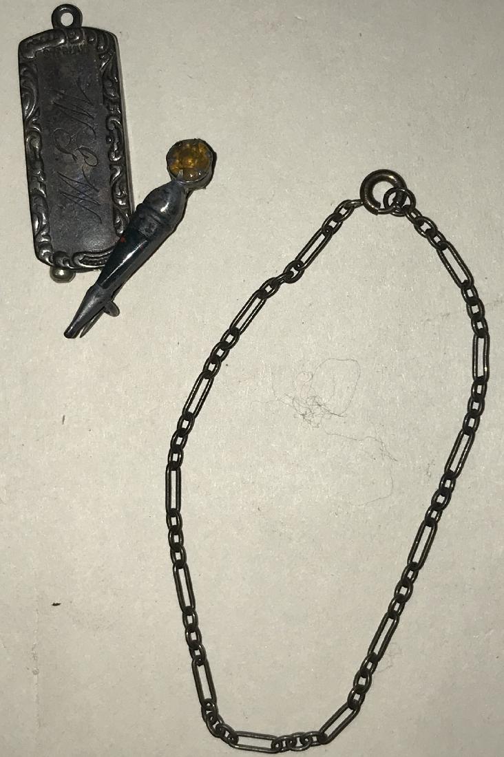 3 Pieces of Sterling Silver: Three pieces of sterling silver, including a pin and cigar cutter. Good condition with wear commensurate with age. For dimensions, see photographs.