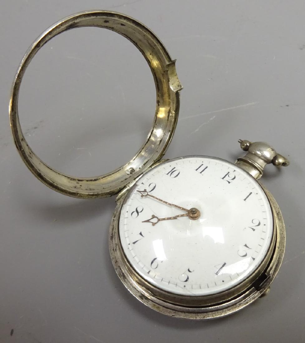 George lll silver pair cased Pocket watch, case: George lll silver pair cased Pocket watch, case engraved Phillips 1816, verge movement engraved Edw. Radford Hanley 669, balance cock pierced and engraved with a profile portrait of Vice-Admiral Horat