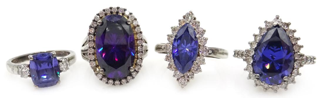 Four silver blue/purple stone and cubic zirconia dress: Four silver blue/purple stone and cubic zirconia dress rings, stamped 925