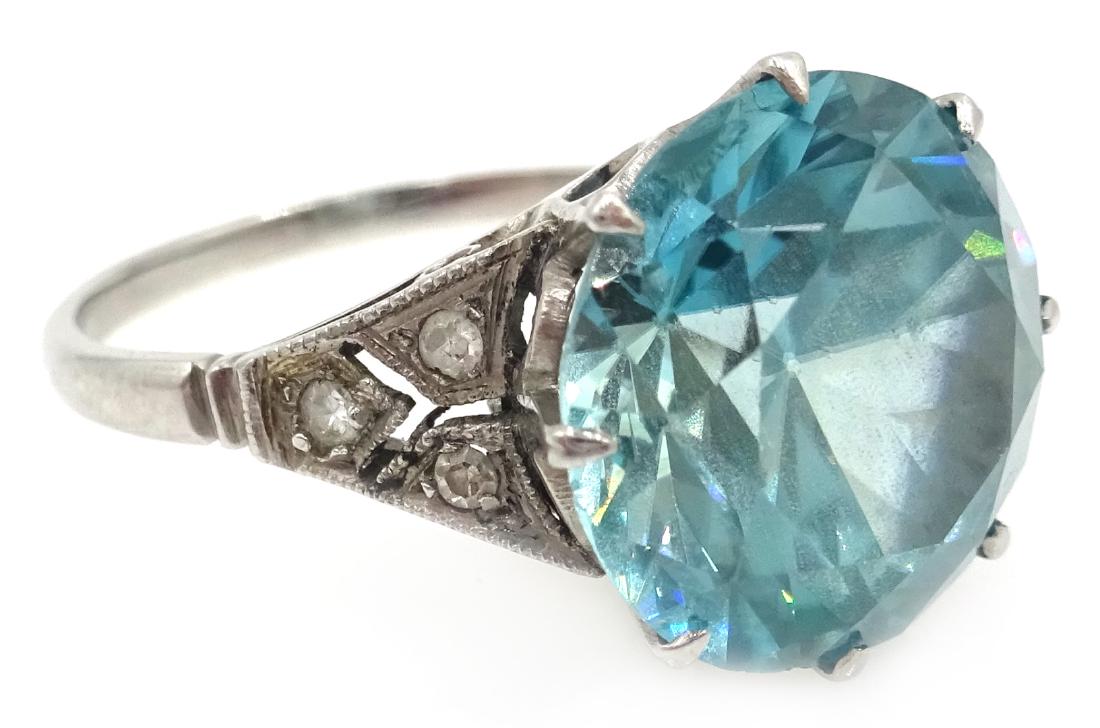 18ct white gold (tested) blue zircon ring, with diamond (1 of 4)