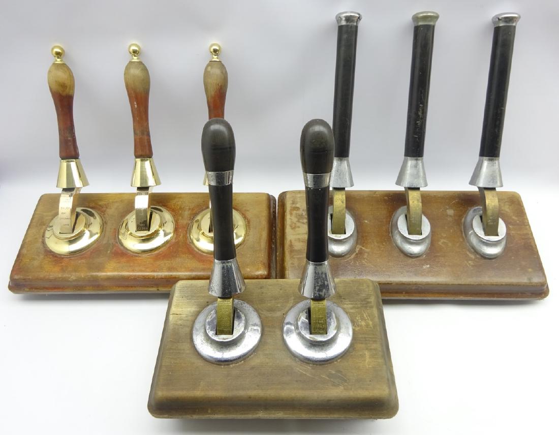 Counter triple beer pump by Gaskell and Chambers dated: Counter triple beer pump by Gaskell and Chambers dated 1945 with brass and turned wood handles, a double pump dated 1949 and one other triple pump 1962