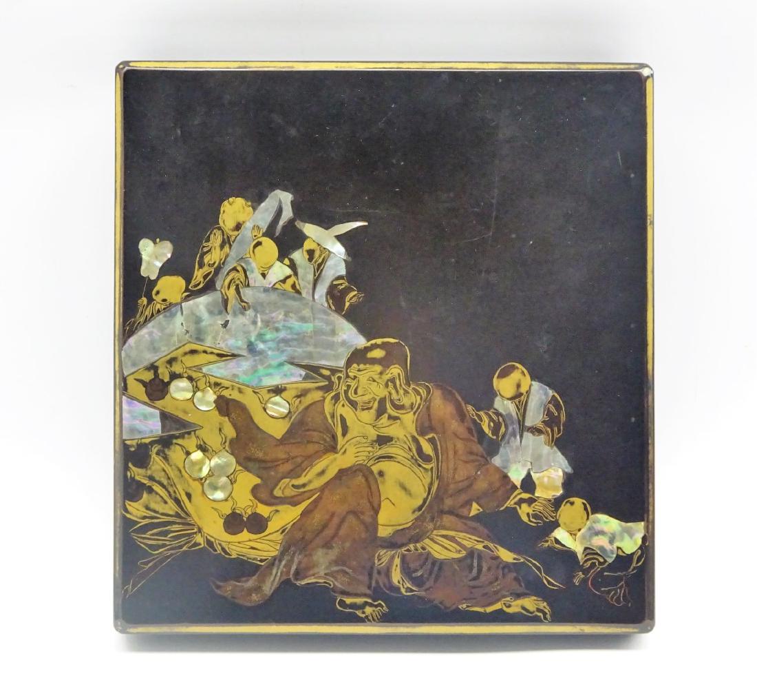Japanese Lacquer Writing box, Edo period, decorated: Japanese Lacquer Writing box, Edo period, decorated with Hotei surrounded by playing children in gold, brown and mother of pearl, the interior with birds among blossoming trees, circular copper water 