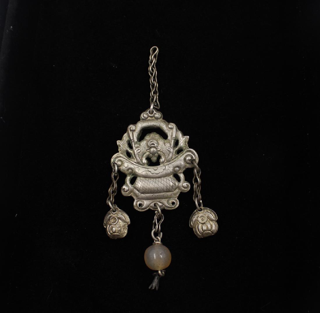 Chinese Silver Qilin Pendant: Chinese Silver Qilin Openwork Pendant with suspended mutton fat jade bead and two silver peach tassels. Pendant Measures: 3" x 1.5" Total Length of 4.25