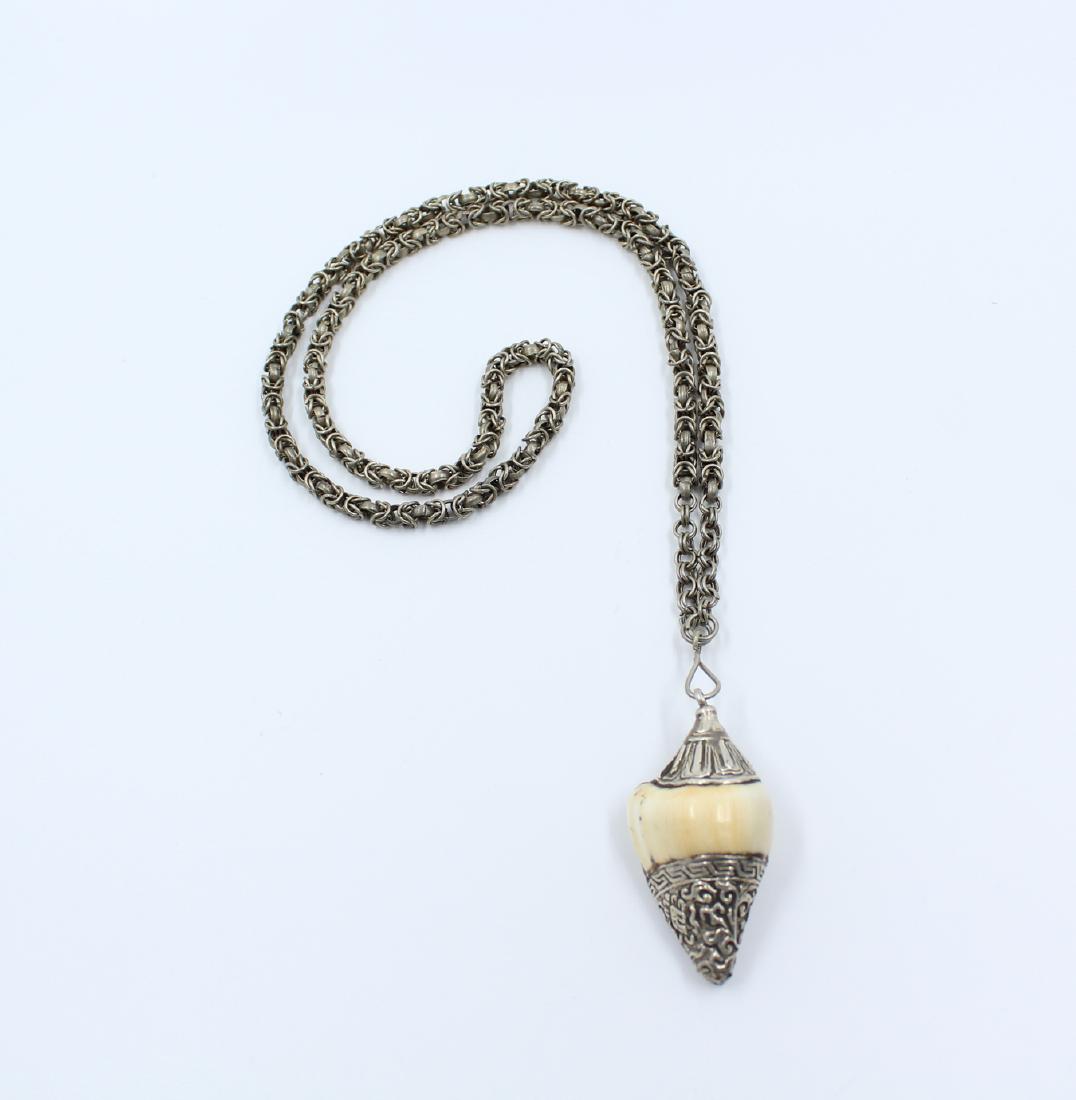 Silver Tibetan Seashell Pendant Necklace: Chain measures 31" Pendant measures 2 1/2" x 1"