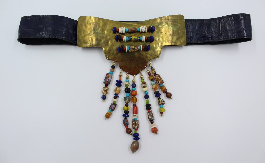 Vintage Hammered Brass Beaded Eel Skin Belt: A very exciting piece indeed! A Large Hammered Brass Shield Plate Center Buckle with Natural Stone and Rolled Ceramic Bead Tassels & Ornamentation on an eel skin belt. Including but not limited to Tur