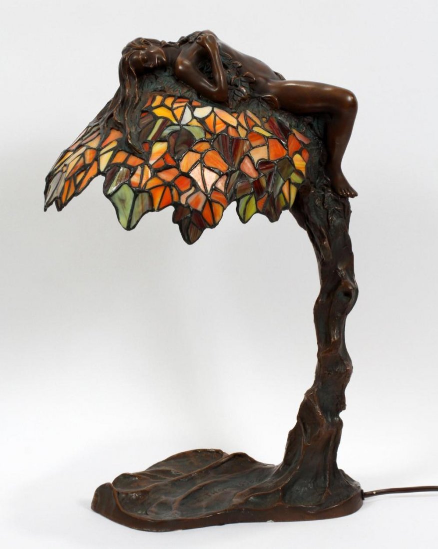 Leaded Glass Shade with Reclining Nude: Leaded glass shade with reclining nude, on a metal lamp base. H 23 in. W 16 in. Signed E. Thomasson. Tree form metal shaft.