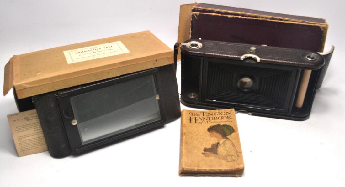 A KODAK pocket folding BROIWNIE No3A, still in its box,: A KODAK pocket folding BROIWNIE No3A, still in its box, and a plate back and some plate holders and an ENSIGN handbook of phototography