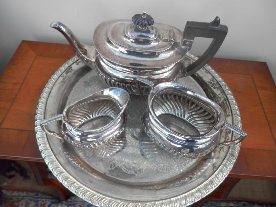 Silver plate tea pot, milk jug and sugar bowl on silver (1 of 1)