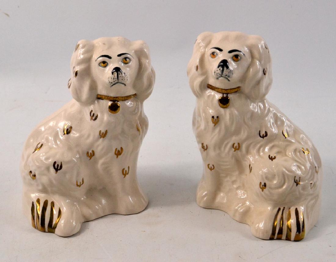 Stunning 2 miniature chimney dogs, in cream glaze and: Stunning 2 miniature chimney dogs, in cream glaze and in gold and black paint W: 10cm approx D: 8.5cm approx