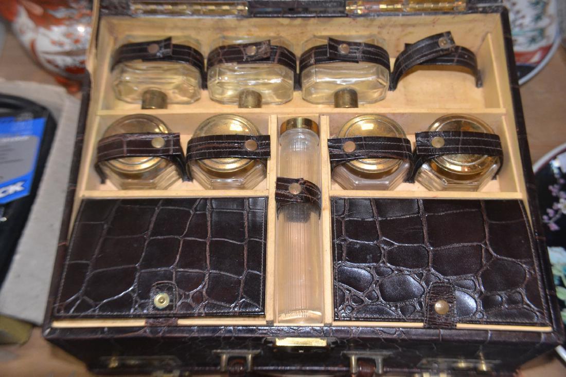 A cased travelling toiletries set in a crocodile skin (1 of 3)