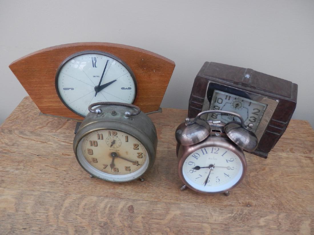 A collection of 4 small clocks of varying age and: A collection of 4 small clocks of varying age and origin