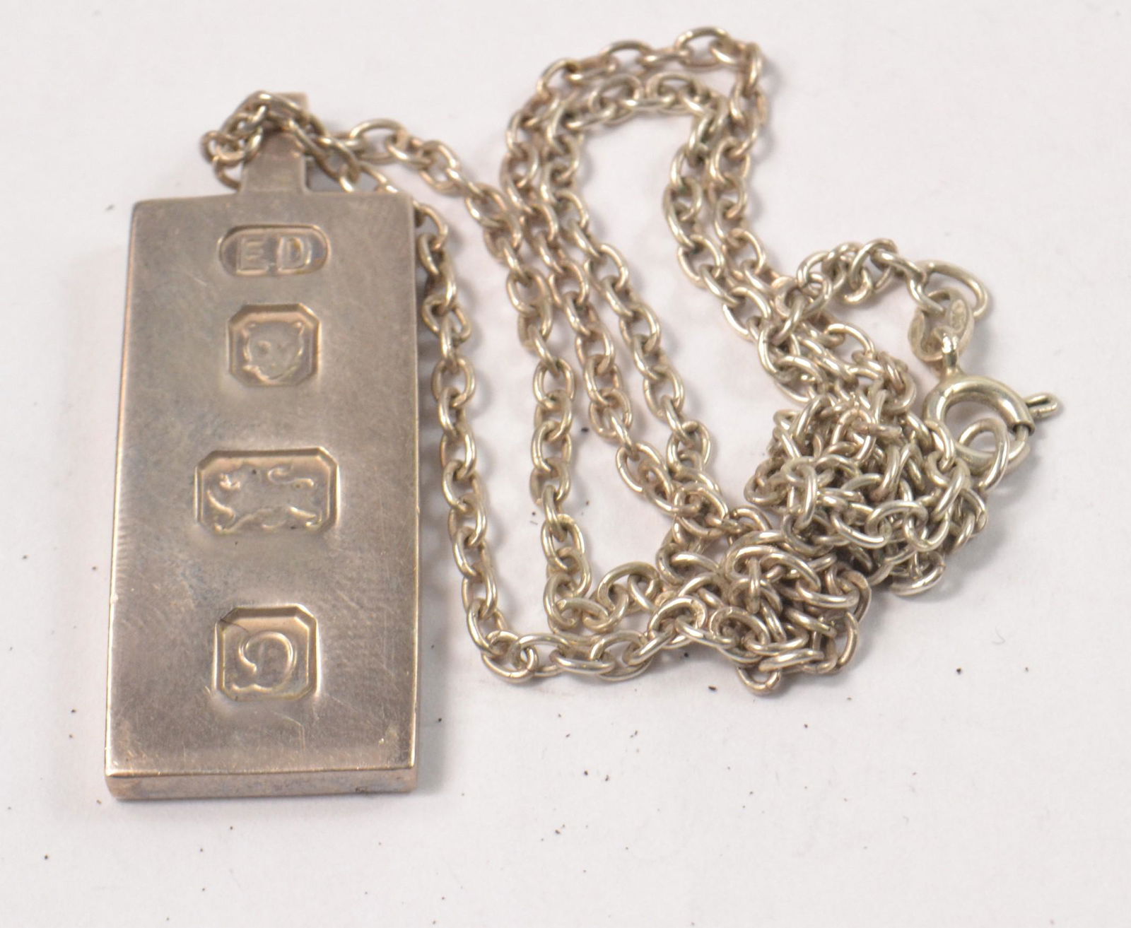 HALLMARKED silver ingot on a 925 stamped silver chain: HALLMARKED silver ingot on a 925 stamped silver chain weight 19.07g Approx 2 pieces