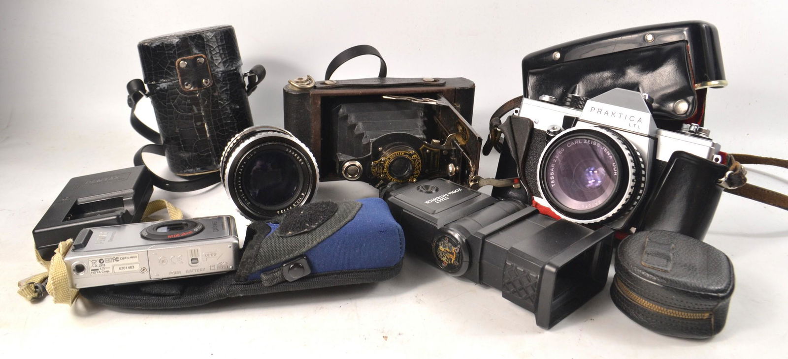 Mixed box of camera equipment, to include a ZEISS JENA: Mixed box of camera equipment, to include a ZEISS JENA DDR zoom lens with case, a PRAKTIKA LTL camera with case, a Flash gun, BROWNIE No2 concertina camera, a PENTAX OPTIO W60 etc