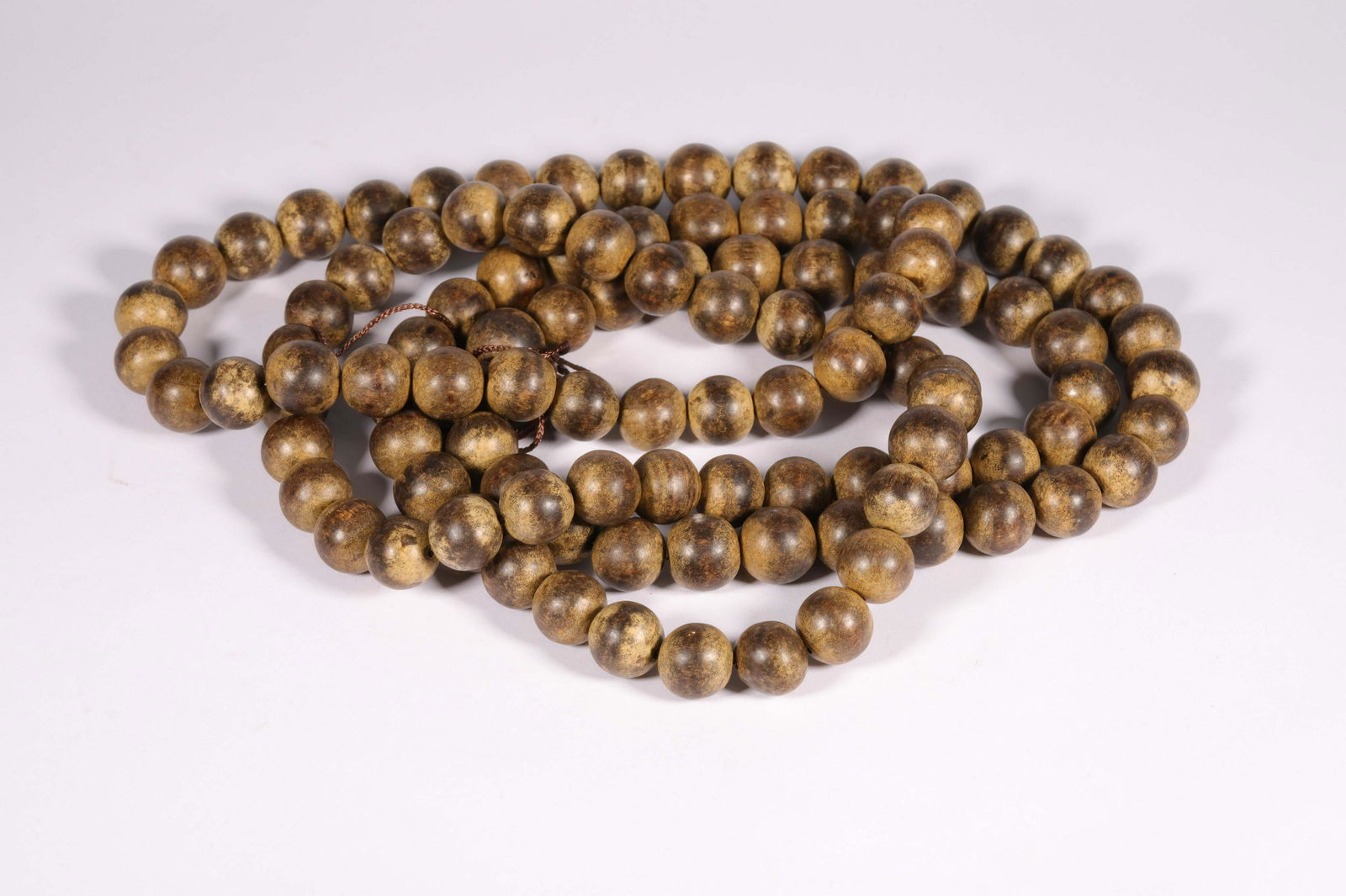 A CHINESE BUDDHIST AGARWOOD BEADS (1 of 8)