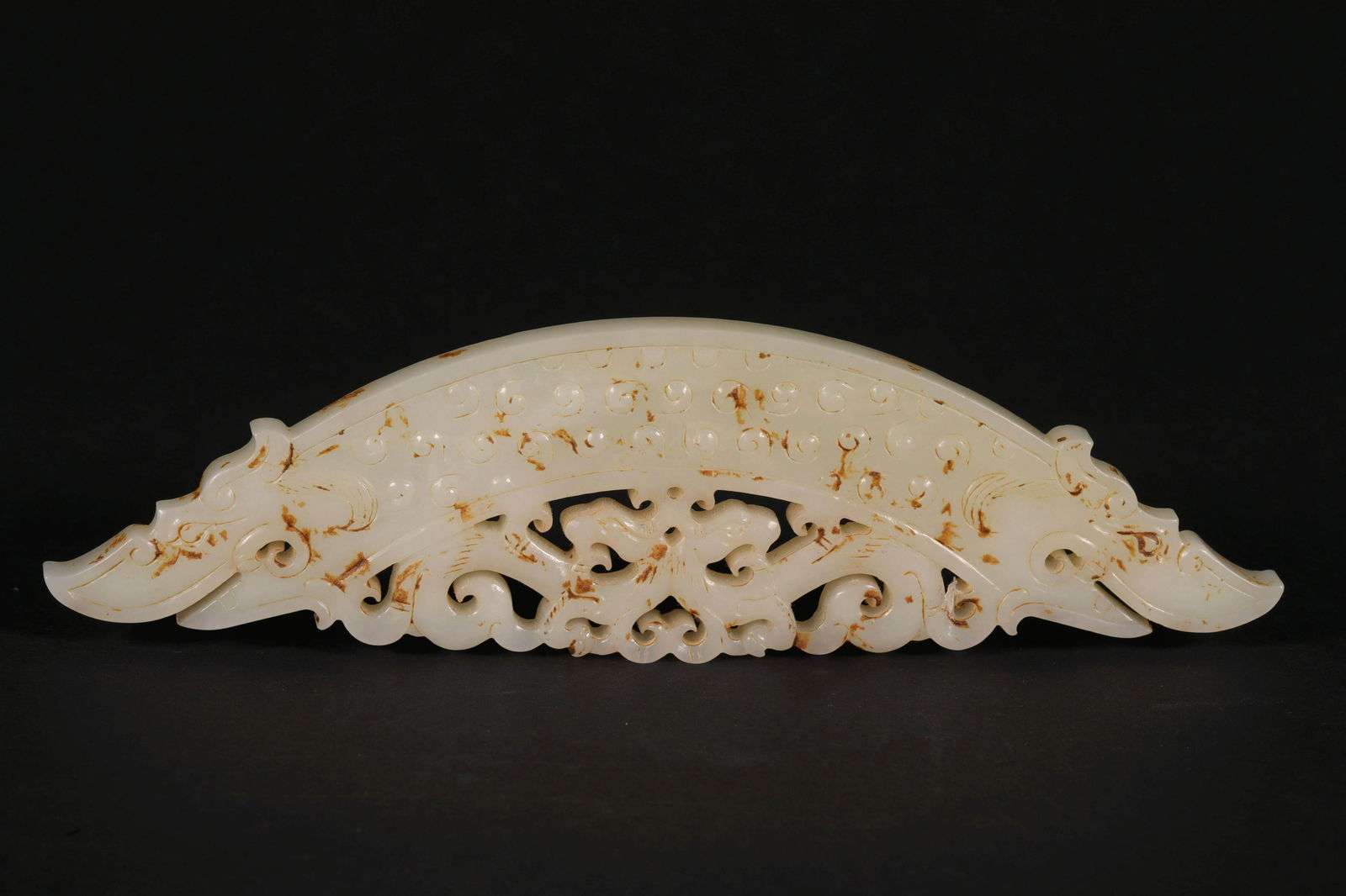 A "HUANG": A "HUANG" WITH ELABORATED CRAFTSMANSHIP; MUTTON FAT JADE; H:4cm W:14cm