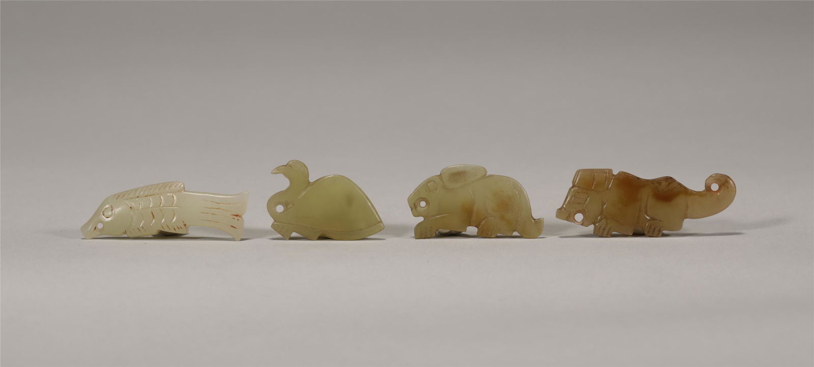 A SET OF FOUR DECORATIVE JADE CARVINGS (1 of 7)