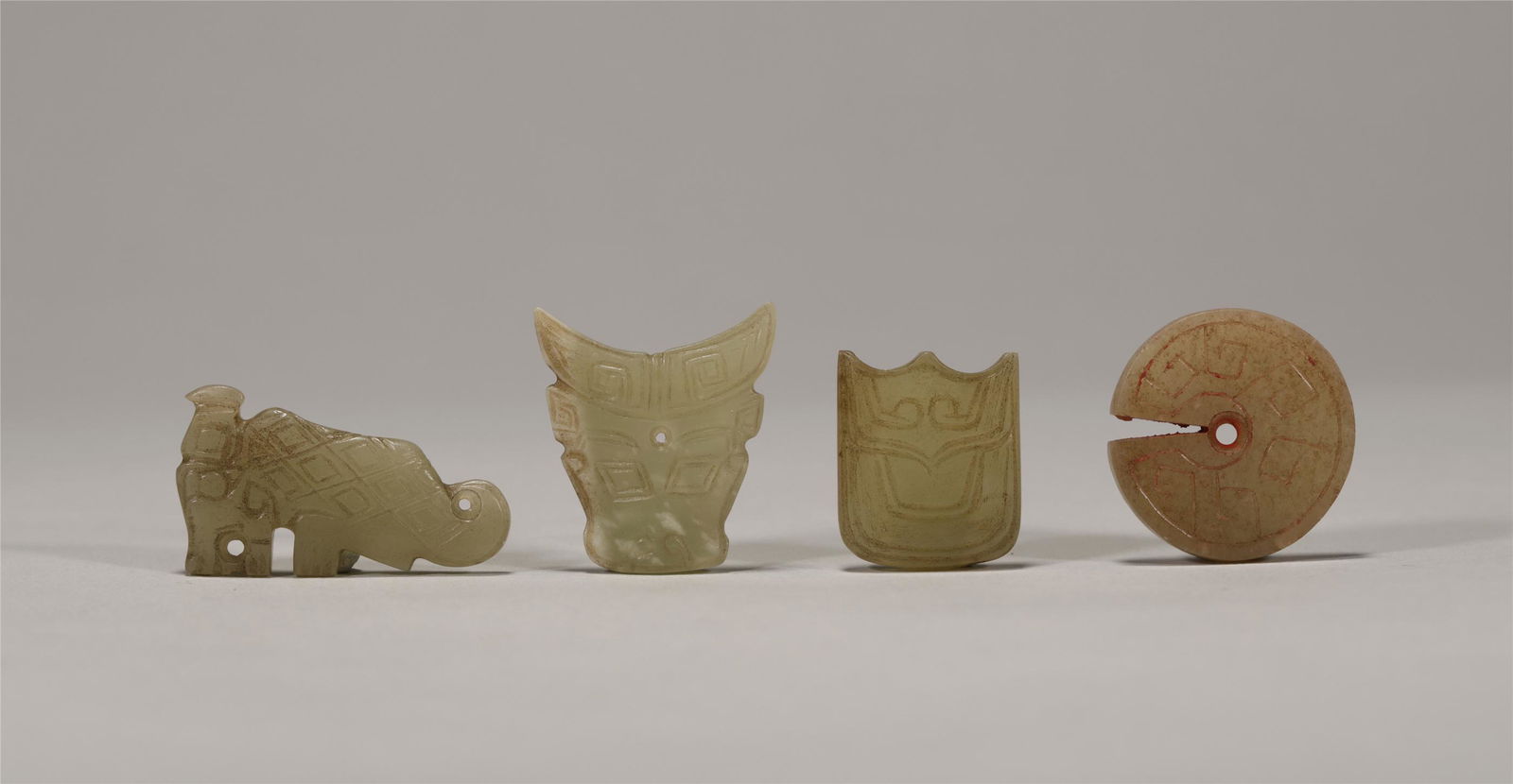 A SET OF JADE CARVING PIECES (1 of 6)